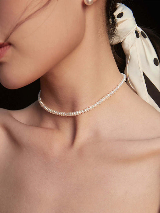 "Timeless classic pearl necklace" "Elegant natural pearl necklace" "Traditional pearl necklace for any occasion" "Sophisticated pearl strand necklace" "Chic and timeless natural pearl necklace" "Classic pearl necklace for refined style" "Versatile natural