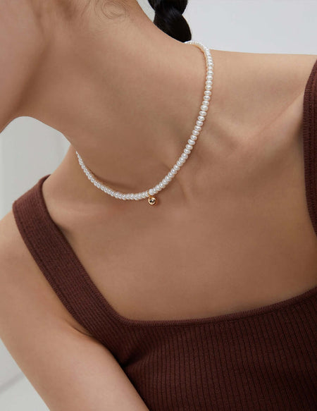 "French-inspired natural pearl silver necklace" "Chic silver necklace with French flair and natural pearls" "Elegant French style pearl necklace in sterling silver" "Sophisticated silver necklace featuring natural pearls, inspired by France" "Timeless Fre