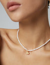 Romantic love pendant silver pearl necklace" "Charming silver necklace with love pendant and pearls" "Elegant pearl necklace featuring a love pendant in silver" "Sentimental love pendant pearl necklace in sterling silver" "Stylish silver necklace with a r